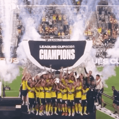 Soccer Players Holding Champions Trophy GIF