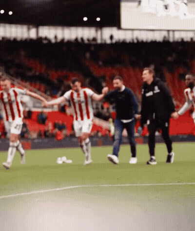 Soccer Players Holding Hands With Asics Hoodie GIF