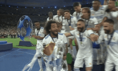 Soccer Players Holding Trophy GIF