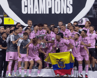 Soccer Players Holding Trophy And Flag In Front Of Champions Sign GIF