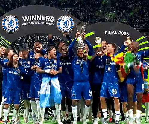 Soccer Players Holding Trophy In Front Of Winners Sign GIF