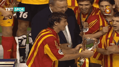 Soccer Players Holding Trophy Number 16 GIF