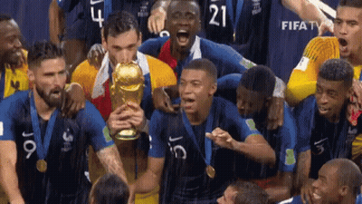 Soccer Players Holding Trophy Number 21 GIF