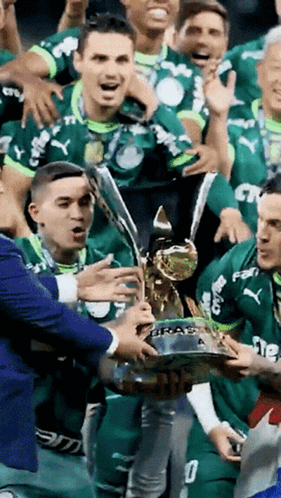 Soccer Players Holding Trophy Saying Braz GIF