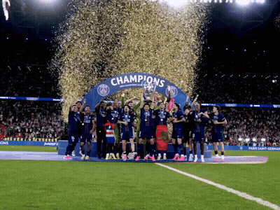 Soccer Players Holding Trophy Under Champions Arch GIF