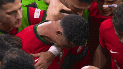 Soccer Players Huddle Around Bwin Sports Shirt GIF