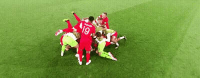 Soccer Players Huddled On Field GIF