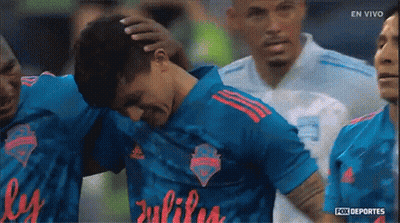 Soccer Players Huddled With Julius Jersey GIF