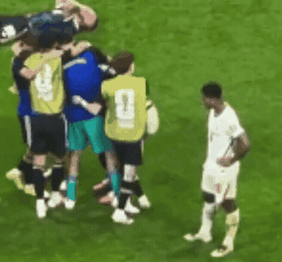Soccer Players Huddled With Number 1 Jersey GIF
