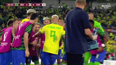 Soccer Players Huddled With Number 9 GIF