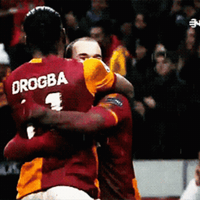 Soccer Players Hugging Drogba GIF