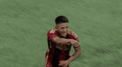 Soccer Players Hugging Number 10 Jersey GIF