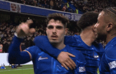 Soccer Players Hugging On Field GIF