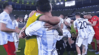 Soccer Players Hugging On Field GIF