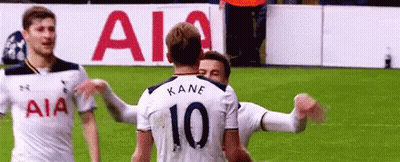 Soccer Players Hugging On Field GIF