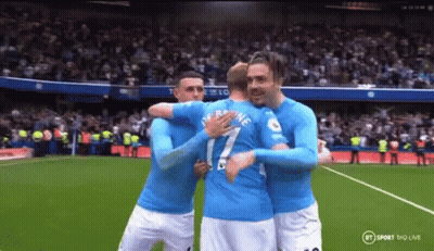 Soccer Players Hugging On Field GIF