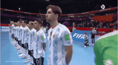 Soccer Players In A Line With FIFA Banner GIF