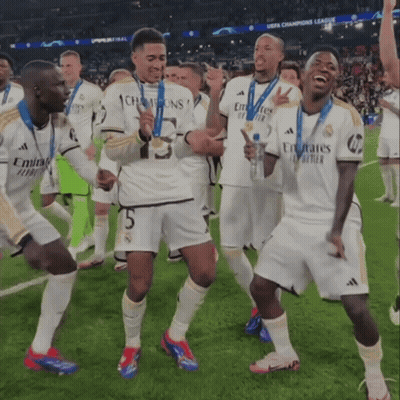 Soccer Players In Emirates Jerseys Celebrate On Field GIF