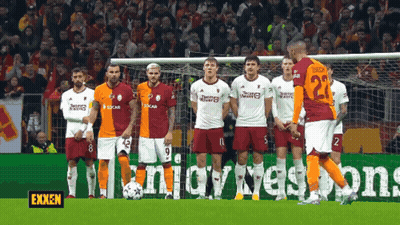 Soccer Players In Front Of Exxon Banner GIF