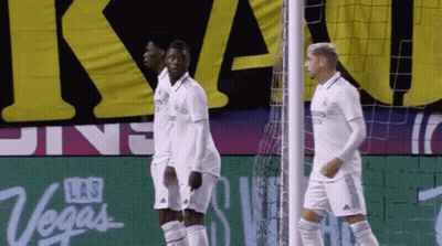 Soccer Players In Front Of Las Vegas Sign GIF