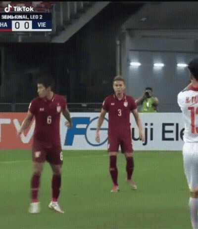 Soccer Players In Front Of TikTok Banner GIF