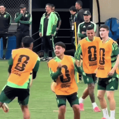 Soccer Players In Green And Yellow Jerseys Number 8 GIF