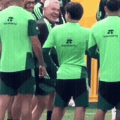 Soccer Players In Green Shirts With Letter J GIF