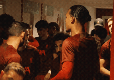 Soccer Players In Locker Room With Shirt Saying A GIF