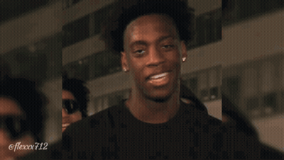 Soccer Players In Orange Vests With Letters U And N GIF