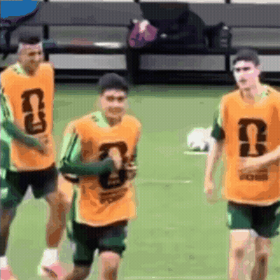 Soccer Players In Orange Vests With UN Letters GIF