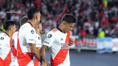 Soccer Players In Red And White Turn Airlin Jerseys GIF