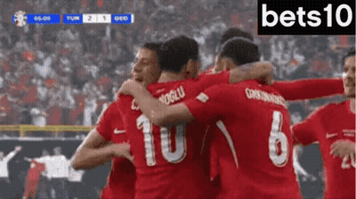 Soccer Players In Red Jerseys 10 And 6 Hugging GIF