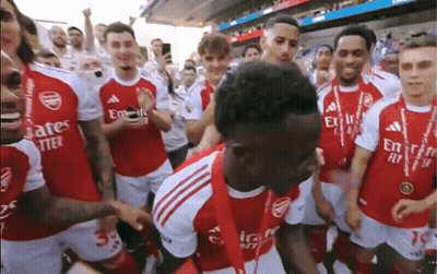 Soccer Players In Red Jerseys With Emirates Fly Better GIF