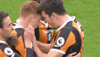 Soccer Players In Umbro Jerseys Hugging GIF