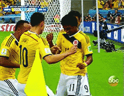 Soccer Players In Yellow Jerseys Number 10 And 11 GIF