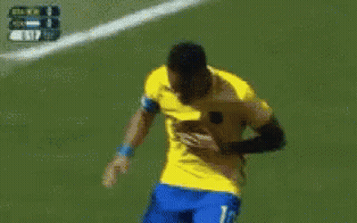 Soccer Players in Yellow Shirts and Blue Shorts