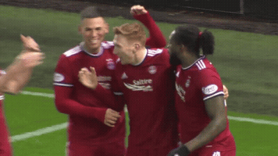 Soccer Players Including Number 8 Hugging GIF