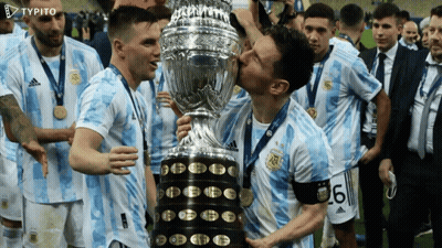 Soccer Players Kissing A Trophy With The Number 6 On Their Shirt GIF