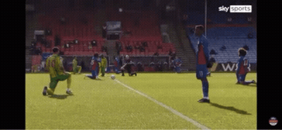 Soccer Players Kneeling On Field GIF