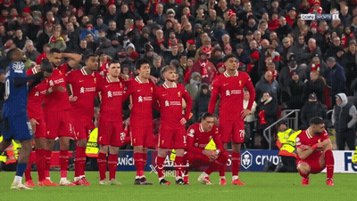 Soccer Players Kneeling On Field With Crowd GIF