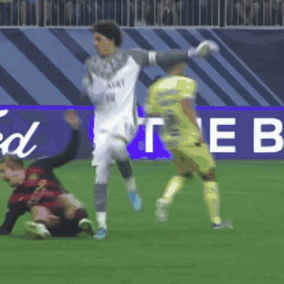 Soccer Players On A Field In Front Of A Sign That Says The B GIF