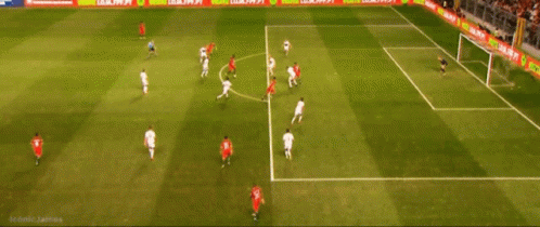 Soccer Players On A Field With A Banner That Says Compre Produto Oficial GIF