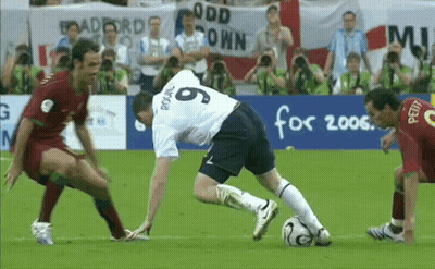 Soccer Players On A Field With A Banner That Says Odd Town GIF