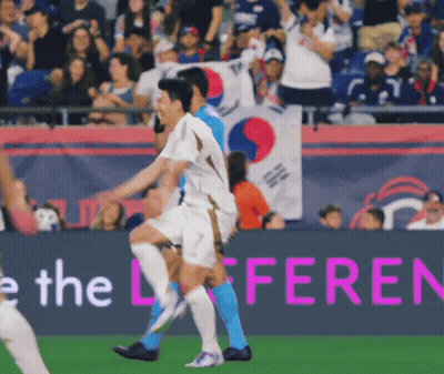 Soccer Players On A Field With A Banner That Says The Difference GIF