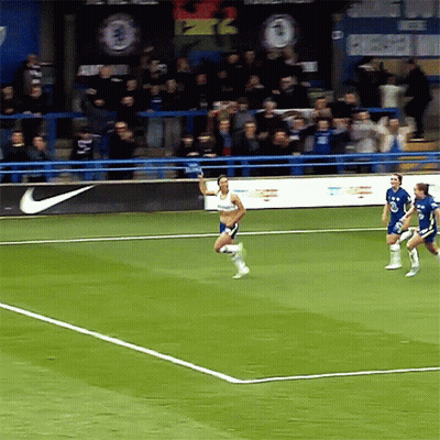 Soccer Players On A Field With A Nike Banner In The Background GIF