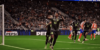 Soccer Players On A Field With A Pepsi Ad GIF
