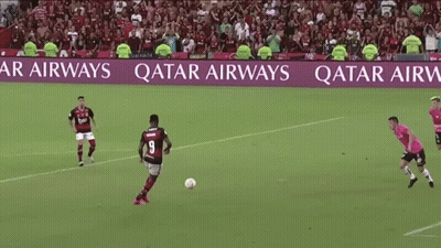 Soccer Players On A Field With A Qatar Airways Banner In The Background GIF