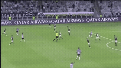 Soccer Players On A Field With A Qatar Airways Banner In The Background GIF