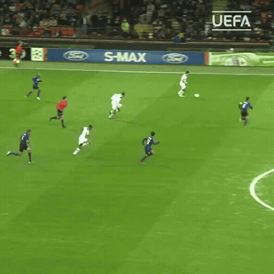 Soccer Players On A Field With A Sign That Says Enjoy Responsibly On It GIF
