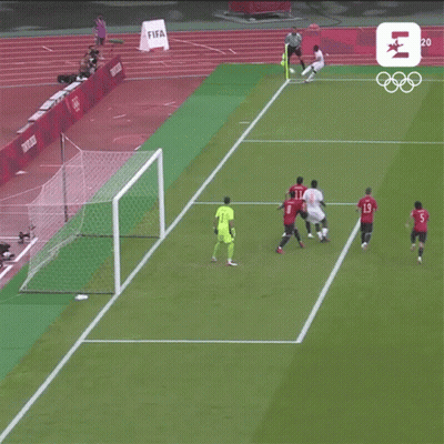 Soccer Players On A Field With A Sign That Says Tokyo 2020 On It GIF